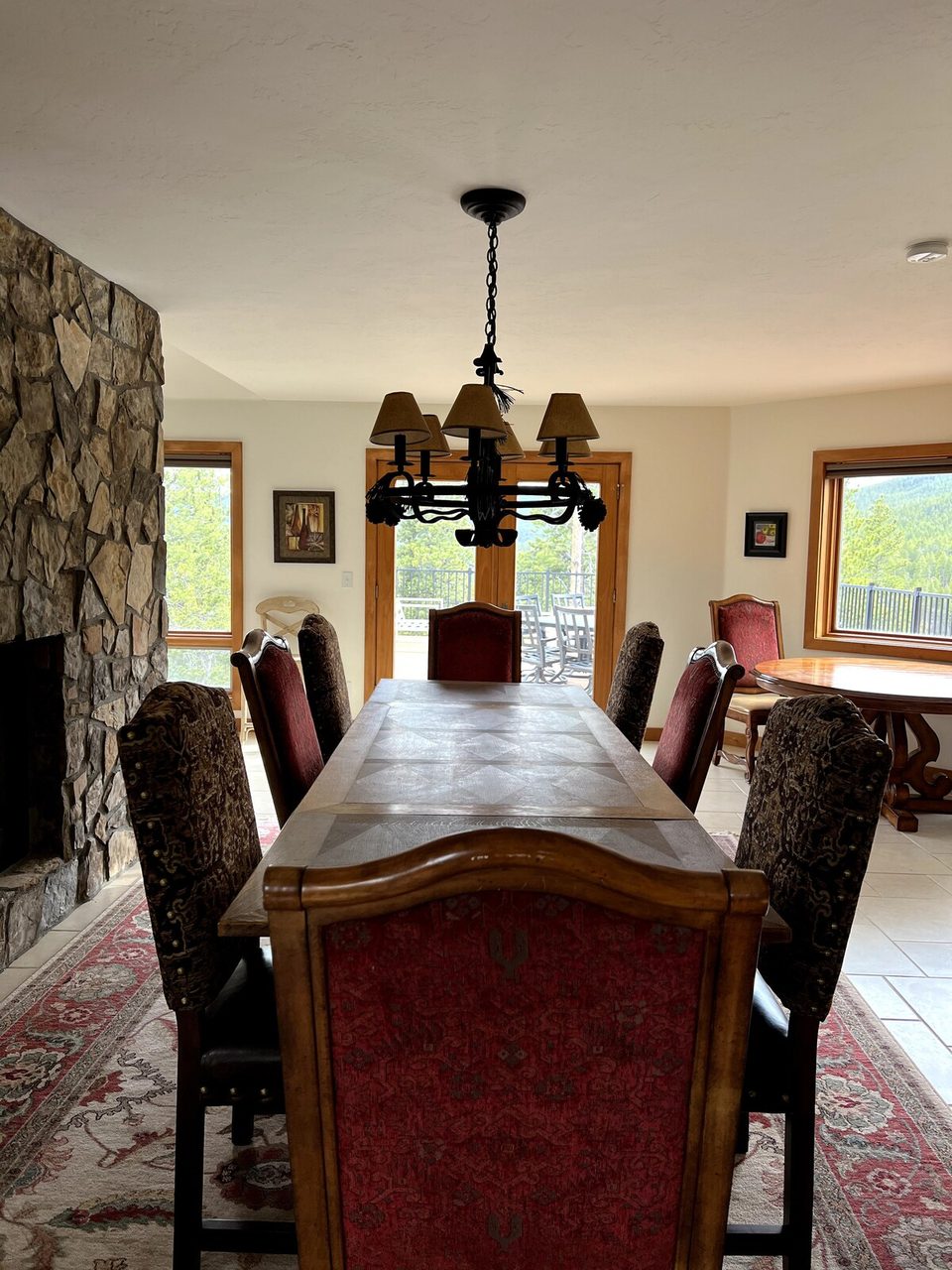 Dining for eight below a second fireplace