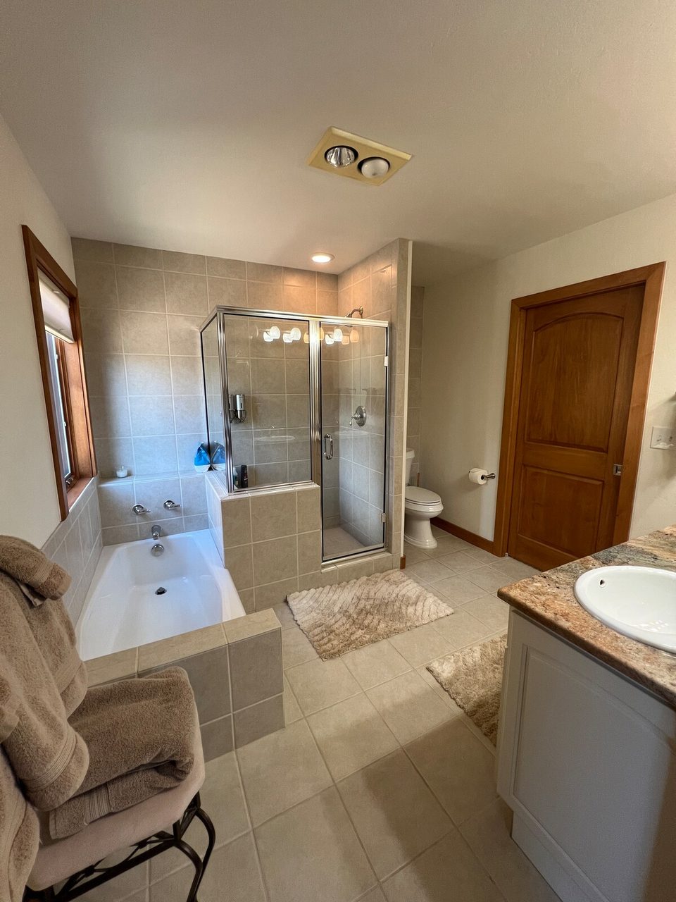 A bath with tub and shower