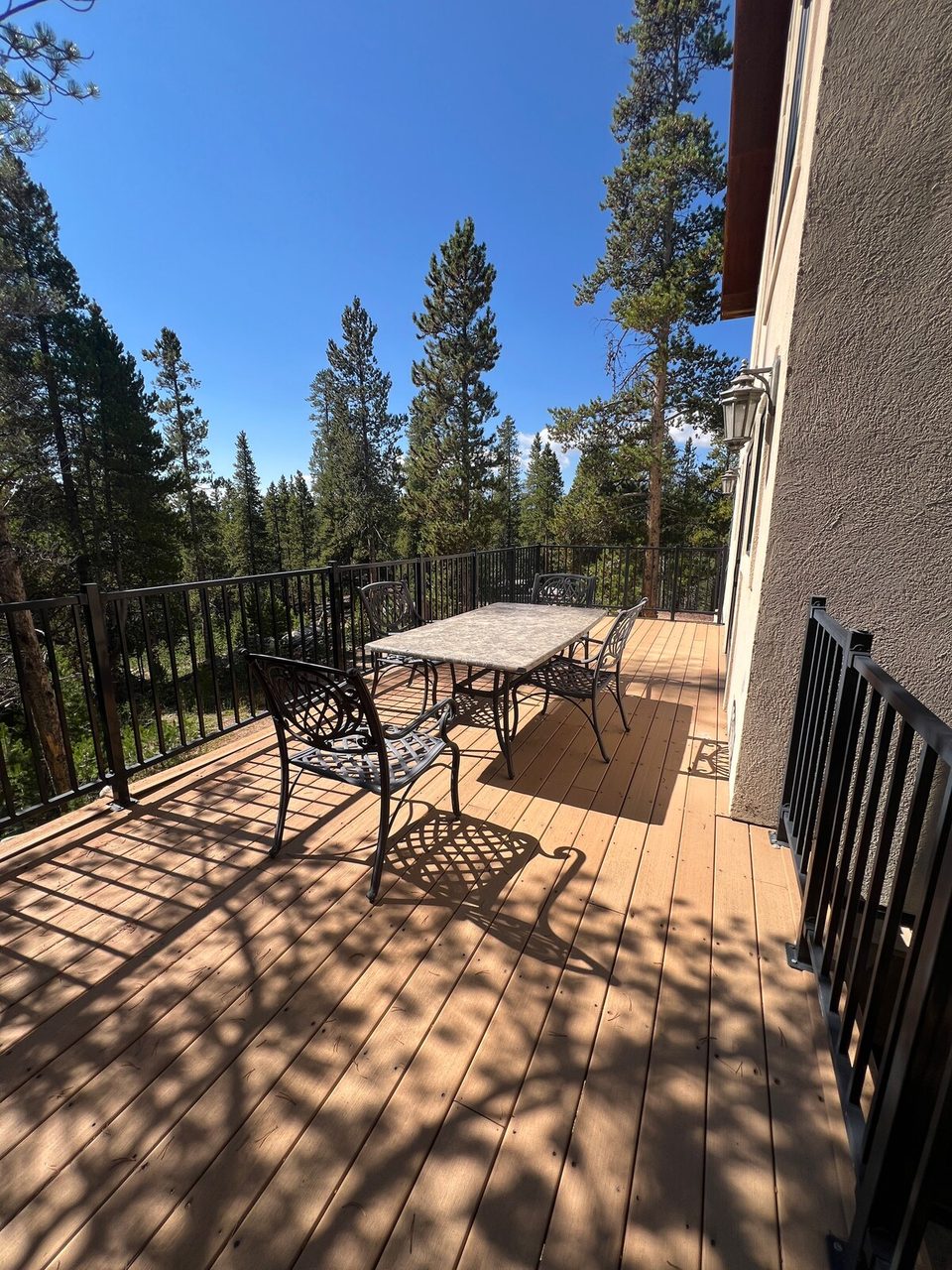 A deck with forest views